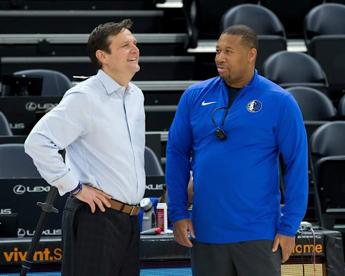 Dennis Lindsey (left) chats with Melvin Hunt (right) prior to a game.